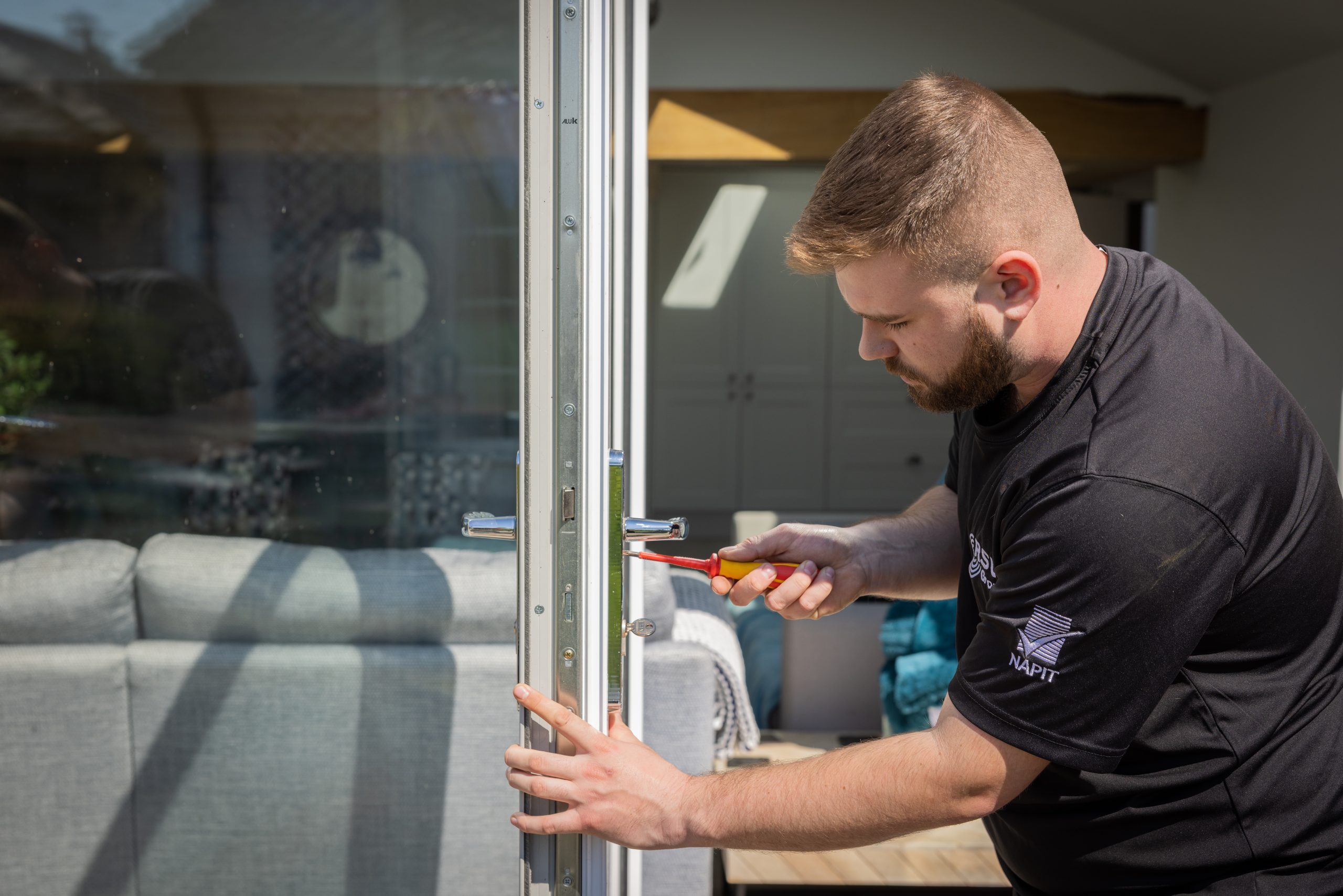 Image showing a repair being carried out to bi-fold doors